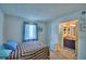 Comfortable bedroom with view of ensuite bath featuring vibrant vanity and shower at 842 Cinnamon Dr, Winter Haven, FL 33880