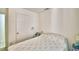 Bedroom featuring a cozy bed with anchor themed spread and an adjoining door at 842 Cinnamon Dr, Winter Haven, FL 33880