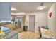 Well-lit kitchen features stainless steel appliances, granite countertops, and a dining area at 842 Cinnamon Dr, Winter Haven, FL 33880