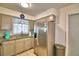 A view of the kitchen features granite counters and stainless steel appliances at 842 Cinnamon Dr, Winter Haven, FL 33880