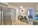 This kitchen features a dining area, granite counters, and a stainless steel refrigerator at 842 Cinnamon Dr, Winter Haven, FL 33880