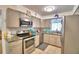 Bright kitchen boasts stainless steel appliances, granite counters, and ample cabinet space at 842 Cinnamon Dr, Winter Haven, FL 33880