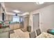 An airy kitchen features granite countertops, a stainless steel refrigerator, and neutral-toned cabinetry at 842 Cinnamon Dr, Winter Haven, FL 33880