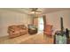 Spacious living room with neutral tones, plush furniture, and plenty of natural light at 842 Cinnamon Dr, Winter Haven, FL 33880