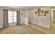 Open-concept living room featuring hardwood floors, and ample natural light at 842 Cinnamon Dr, Winter Haven, FL 33880
