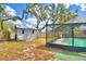 Charming backyard featuring a storage shed adjacent to a screened-in pool, perfect for relaxing and storage at 842 Cinnamon Dr, Winter Haven, FL 33880