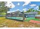 Relax and unwind in this screened-in pool with a spacious deck, ideal for enjoying sunny days at 842 Cinnamon Dr, Winter Haven, FL 33880