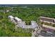 An aerial view showcases the property's architecture, surrounding greenery, and convenient parking at 100 El Camino Dr # 309, Winter Haven, FL 33884