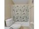 Bathroom with a white toilet and shower with shower curtain at 100 El Camino Dr # 309, Winter Haven, FL 33884