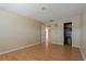 Bedroom with wood flooring and a closet with organizers installed at 100 El Camino Dr # 309, Winter Haven, FL 33884