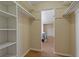 Large walk-in closet featuring shelves and clothing rods for convenient storage solutions at 100 El Camino Dr # 309, Winter Haven, FL 33884