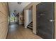 Community hallway featuring tiled floor and access to stairs and courtyard at 100 El Camino Dr # 309, Winter Haven, FL 33884