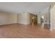 Living room featuring wood flooring and neutral walls with open layout and natural light, perfect for comfortable living at 100 El Camino Dr # 309, Winter Haven, FL 33884