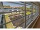 Scenic exterior views of community landscaping from a window with pond at 100 El Camino Dr # 309, Winter Haven, FL 33884