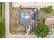 Aerial view showcases the home, large pool, garage and surrounding landscape at 100 Ellen Ct, Winter Haven, FL 33884