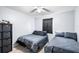 Twin bedroom with two comfortable beds, neutral carpet, and a storage unit at 100 Ellen Ct, Winter Haven, FL 33884