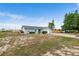 Quaint single-story home with a spacious yard, attached garage, and wooden fence, providing comfort and privacy at 100 Ellen Ct, Winter Haven, FL 33884
