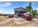 Large metal garage with concrete pad provides ample space for vehicles and projects at 100 Ellen Ct, Winter Haven, FL 33884