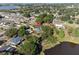 Scenic aerial shot of a community near a lake with ample tree coverage at 102 Lake Ring Dr, Winter Haven, FL 33884