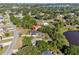 Beautiful aerial view showcasing homes nestled among trees near a serene lake at 102 Lake Ring Dr, Winter Haven, FL 33884