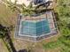 Aerial view showcases the screened-in pool and manicured backyard at 102 Lake Ring Dr, Winter Haven, FL 33884