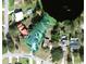 Aerial view showing property lines of a home near a small lake at 102 Lake Ring Dr, Winter Haven, FL 33884