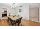 Bright dining room featuring hardwood floors, modern lighting, and a spacious layout at 102 Lake Ring Dr, Winter Haven, FL 33884
