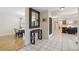 Open hallway with ceramic tile and views of dining and living areas at 102 Lake Ring Dr, Winter Haven, FL 33884