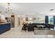 Bright, open living room featuring a kitchen view and modern finishes at 102 Lake Ring Dr, Winter Haven, FL 33884