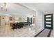 Spacious living room featuring tiled floors, a large front door, and ample natural light at 102 Lake Ring Dr, Winter Haven, FL 33884