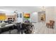 Spacious living room with tile floors, modern furnishings, and a cozy brick fireplace feature at 102 Lake Ring Dr, Winter Haven, FL 33884