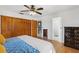 Spacious main bedroom with hardwood floors, closet space, and an ensuite bathroom at 102 Lake Ring Dr, Winter Haven, FL 33884