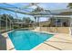 Inviting screened-in pool surrounded by well-maintained patio space at 102 Lake Ring Dr, Winter Haven, FL 33884