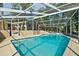 Refreshing screened-in pool with clear blue water and ample deck space at 102 Lake Ring Dr, Winter Haven, FL 33884
