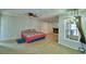 Large room features wood-look floors and a view into the living area with fireplace at 103 Lake Thomas Dr, Winter Haven, FL 33880