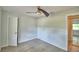 Neutral bedroom with a ceiling fan and hardwood floors at 103 Lake Thomas Dr, Winter Haven, FL 33880