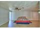 Spacious room featuring wood-look flooring and a ceiling fan for added comfort at 103 Lake Thomas Dr, Winter Haven, FL 33880
