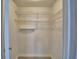 Walk-in closet features wire shelving perfect for organizing clothing and other items at 103 Lake Thomas Dr, Winter Haven, FL 33880