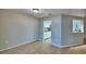 Bright dining area featuring wood floors and an open view to the kitchen at 103 Lake Thomas Dr, Winter Haven, FL 33880