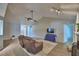 Bright and airy living room with vaulted ceilings and a view of the backyard at 103 Lake Thomas Dr, Winter Haven, FL 33880