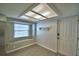 Bright mudroom with tile flooring and an exterior door at 103 Lake Thomas Dr, Winter Haven, FL 33880