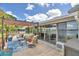 Spacious patio with outdoor seating, pergola, and scenic lake views creating an inviting outdoor living space at 103 Lake Thomas Dr, Winter Haven, FL 33880