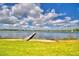 Scenic waterfront view featuring a private dock and serene water at 103 Lake Thomas Dr, Winter Haven, FL 33880
