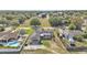 Aerial view of the home, with a carport, surrounded by greenery in a suburban neighborhood at 1032 Tower Blvd, Lake Wales, FL 33853