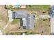 Aerial view of the house showcasing the roof, driveway and backyard layout at 1032 Tower Blvd, Lake Wales, FL 33853