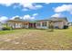Spacious backyard with lush lawn and patio at 1032 Tower Blvd, Lake Wales, FL 33853