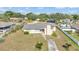 Aerial view of a single story home with a chimney and front yard surrounded by mature trees at 1032 Tower Blvd, Lake Wales, FL 33853