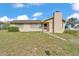 Charming single-story home featuring a unique chimney and cozy curb appeal in a residential neighborhood at 1032 Tower Blvd, Lake Wales, FL 33853