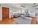 Bright living room with hardwood floors, neutral furniture, and large window at 1032 Tower Blvd, Lake Wales, FL 33853