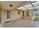 Covered patio area with multiple access doors at 1032 Tower Blvd, Lake Wales, FL 33853